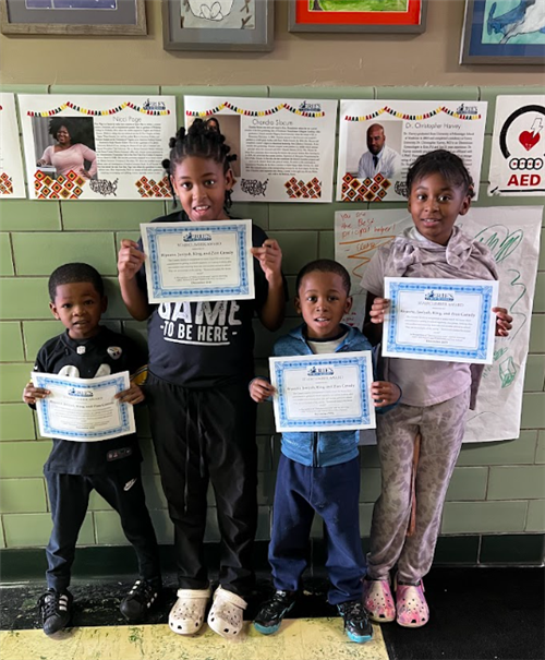Canady Family, Edison's Stairclimber for December, pose with their award plaques.
